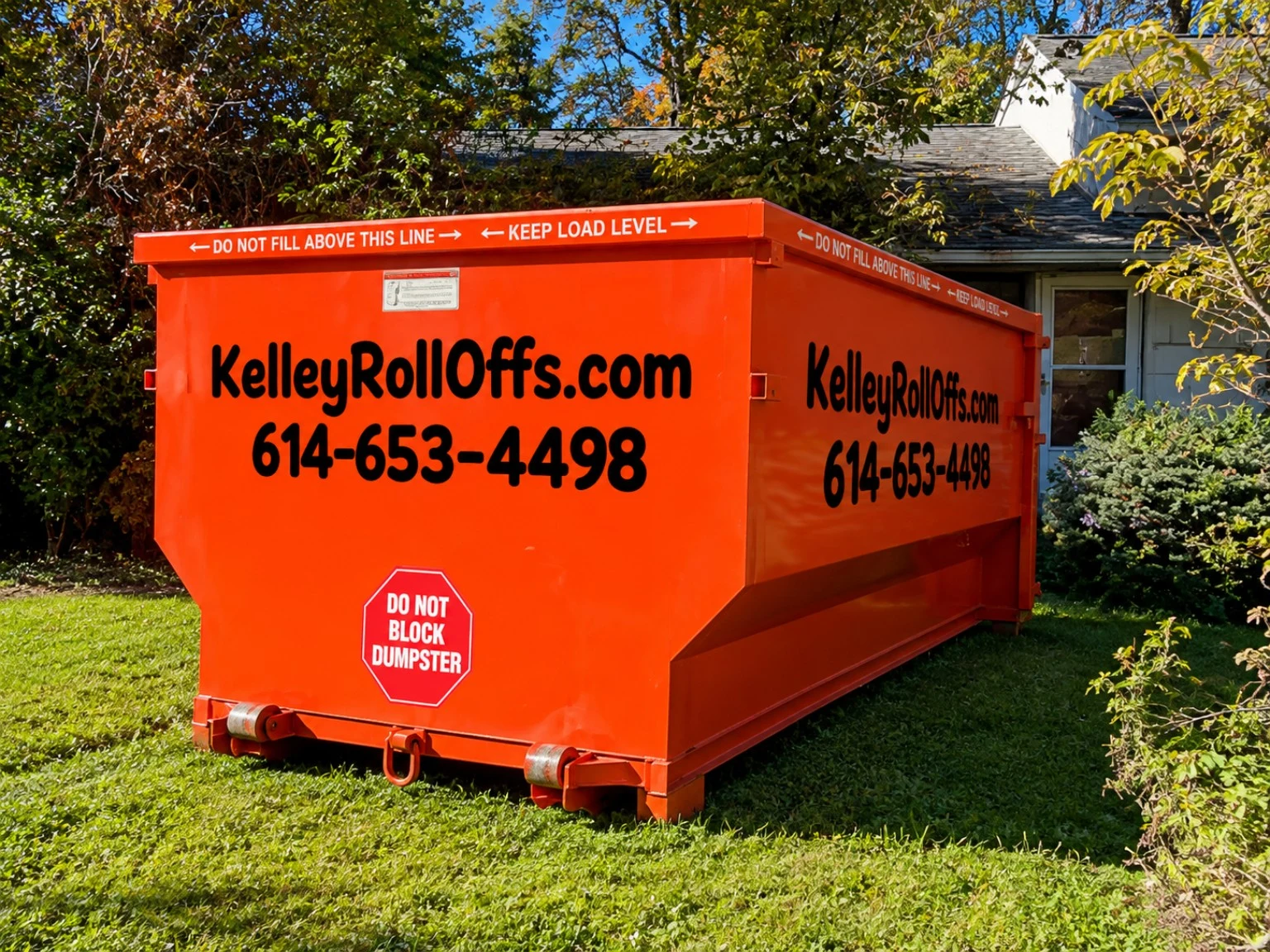 Orange Kelley Roll Offs dumpster at a Columbus home